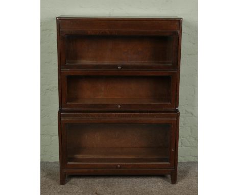 A Globe Wernicke style stacking three section bookcase with glazed doors, makers label for Gunn to inside.Hx122cmWx87cmDx31cm