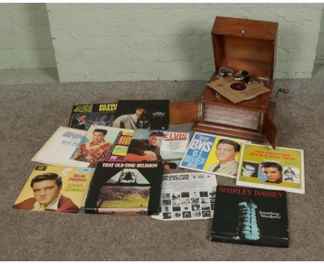 An unmarked 1930s windup gramophone featuring Golding sound box along with a small quantity of vinyl LP records of mostly Elv