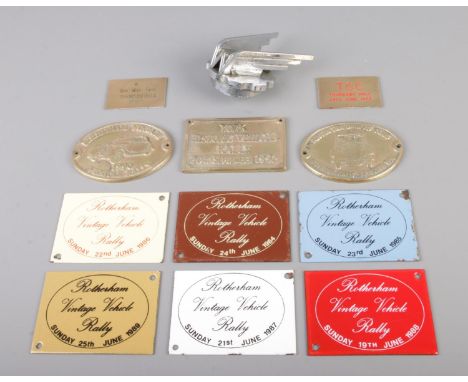 A Wolseley car mascot with a collection of small enamel and cast metal plaques for Rotherham Vintage Vehicle Rally and other 