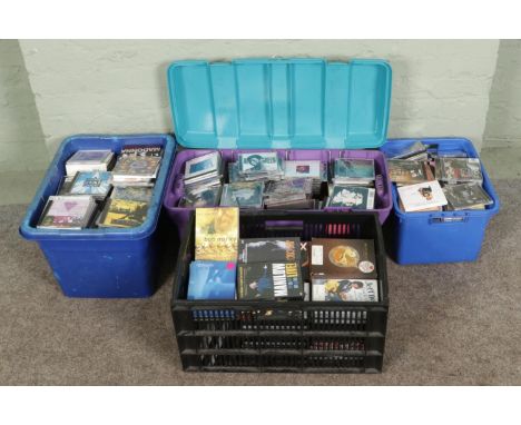 Three boxes of CDs and one box of assorted DVDs, including Elvis Presley, Amy Winehouse, Elton John, T-Rex, John Lennon, N.E.