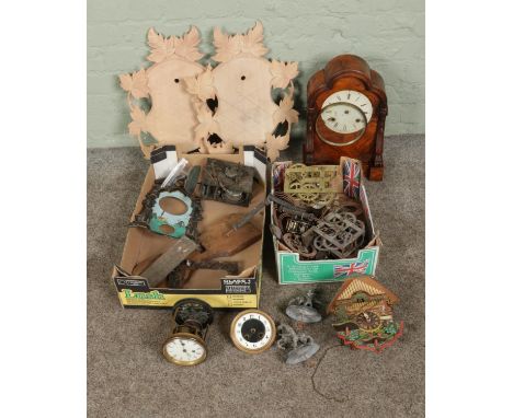 Two boxes of assorted clock spares and repairs to include burr walnut mantle clock for repair, assorted movements, finials, e