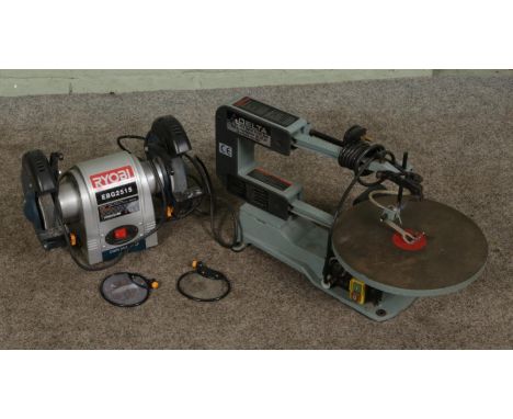 A Delta 16" variable scroll saw along with a Ryobi twin belt sander, EBG2515.