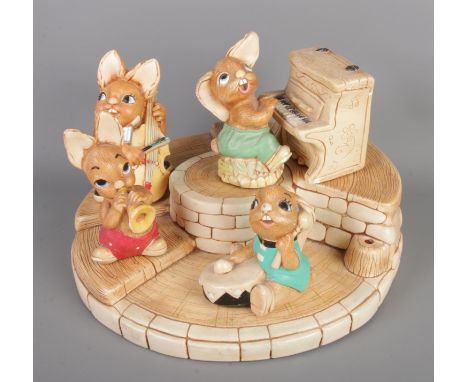 A collection of Pendelfin Rabbits. Including stand base, piano and Bongo, Phumf, Bliss, Thumper.