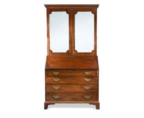 dentil cornice above two mirror panelled doors above four long drawers on bracket feet 209 x 112 x 58cm