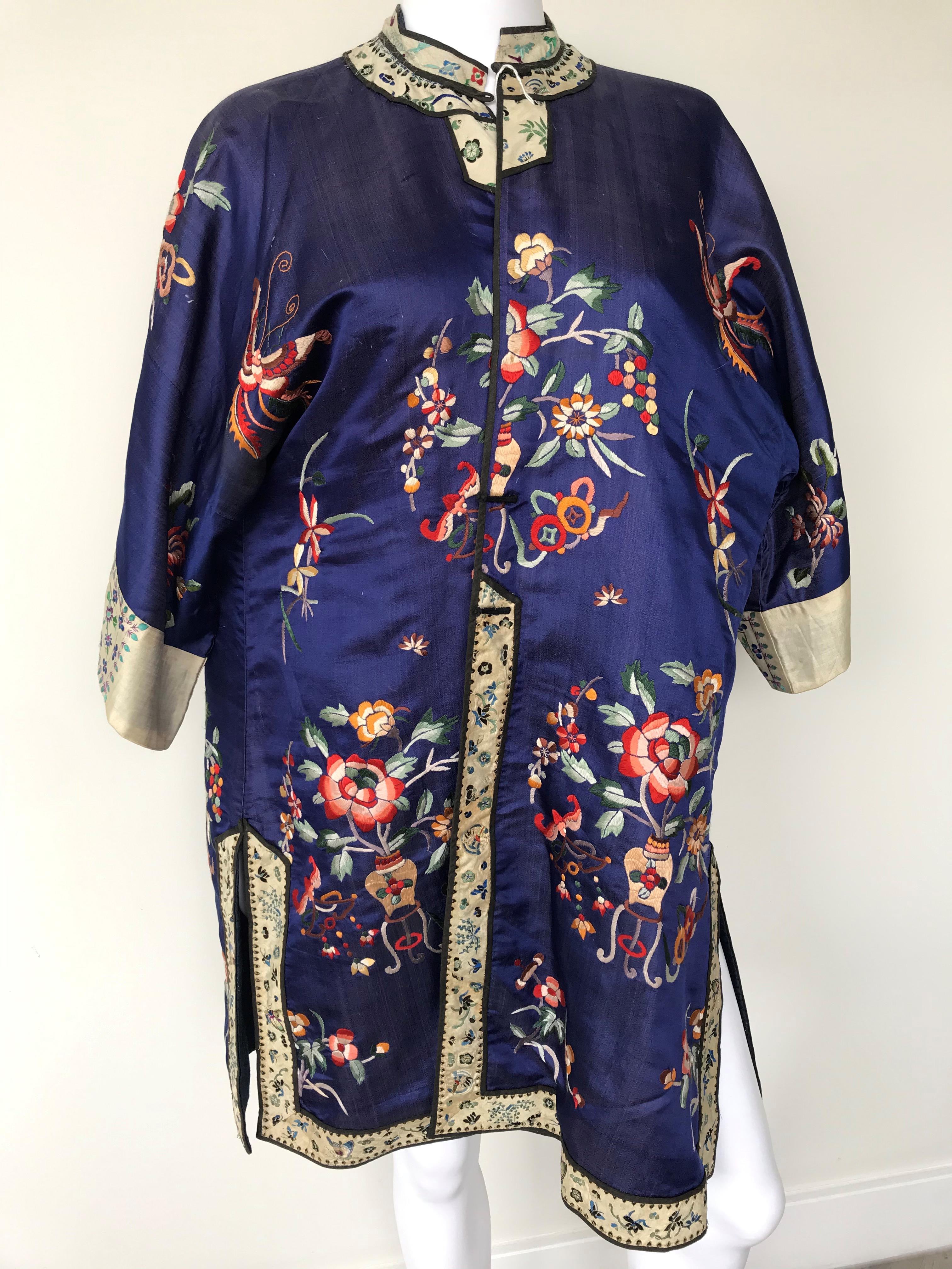 A Chinese navy blue silk and embroidered summer coat, circa 1925, in ...