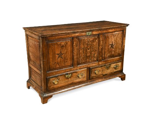 the hinged top above three panel front and a pair of drawers raised on later bracket feet 77 x 124 x 49cm