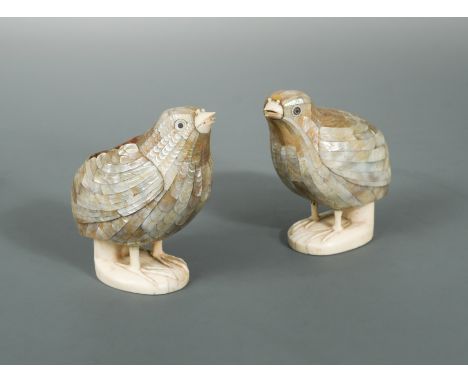 with ivory beaks, legs and feet integral to the stands, inset mother of pearl seals, 10.9 cm high (one lacking lid) (2)