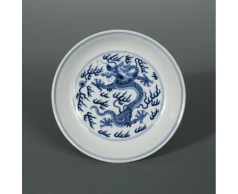 of shallow circular form, with central horned dragon pursuing a pearl amongst flames, the external wall with two further drag