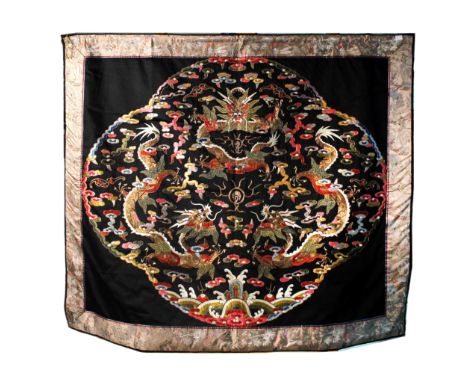 the quatre-lobed black field enclosing three sky dragons around the cosmic pearl, enriched in gold wrapped threads within flo