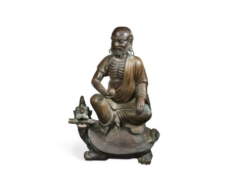 the bearded sage seated upon the back of a mythical turtle, holding a pearl and scroll respectively 72cm highFootnote: Proven