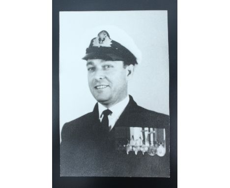 A signed portrait photograph of Royal Navy Lieutenant Thomas William Gould, one of three Jewish recipients of the Victoria Cr