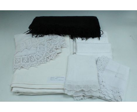 A large vintage linen tablecloth together with a small quantity of vintage tablecloths 