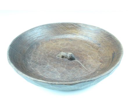 A Robert "Mouseman " Thompson of Kilburn carved oak fruit bowl, being a wide shallow bowl having the trademark mouse carved t