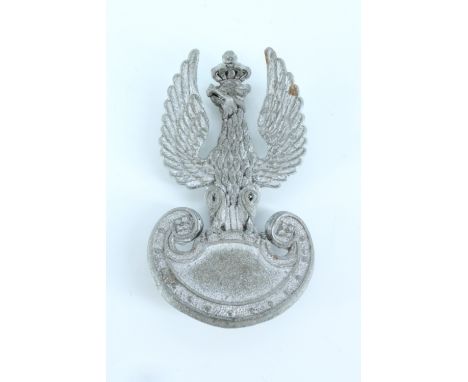 A Second World War Free Polish Army plastic cap badge