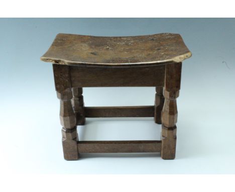 Robert "Mouseman" Thompson of Kilburn, an oak joynt stool, having carved octagonal baluster legs and four stretchers, pegged 