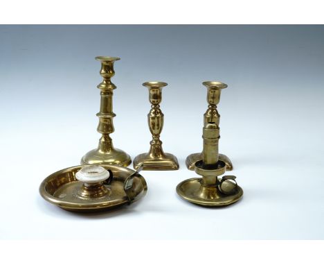 A group of 19th Century domestic lighting comprising a Palmer &amp; Co brass chamberstick with spring-eject, another chambers