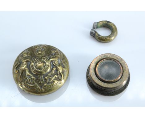 A Second World War escape and evasion button compass, being a small brass General Service cap button with left-hand-screw bac