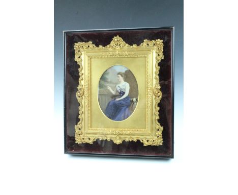 A Belle Epoque portrait on glass or porcelain of a genteel young lady sat on a veranda reading a letter, in richly ornamented