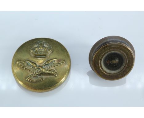 A Second World War escape and evasion button compass, being a small brass RAF button with left-hand-screw back, opening to re