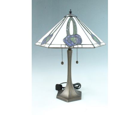 A contemporary Art Nouveau style table lamp, having a bronzed base of flared form and polygonal section, its shade of conform