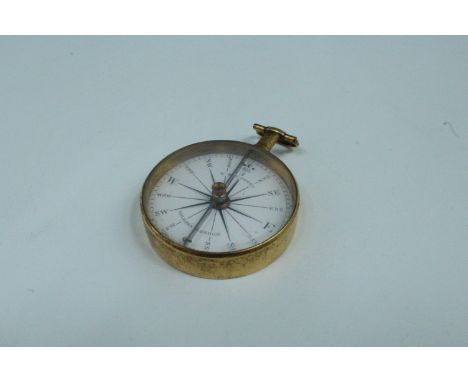 A George III pocket magnetic compass by W &amp; S Jones of Holborn, London, in gilt metal case and having an enamel rose, 46 