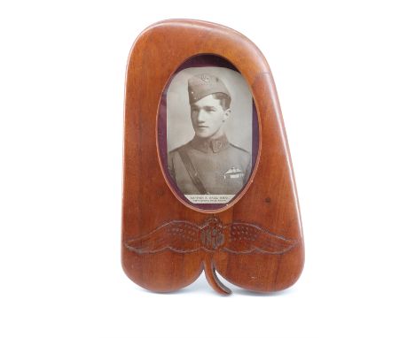 A Great War Royal Flying Corps propeller tip photograph frame, decorated with carved pilot's wings and bearing a portrait of 