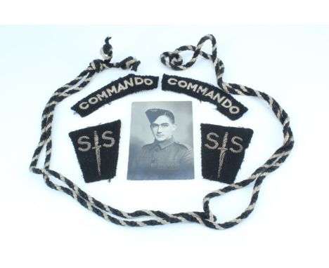 A group of Second World War No 2 Commando insignia with provenance, comprising a pair of embroidered Commando shoulder titles