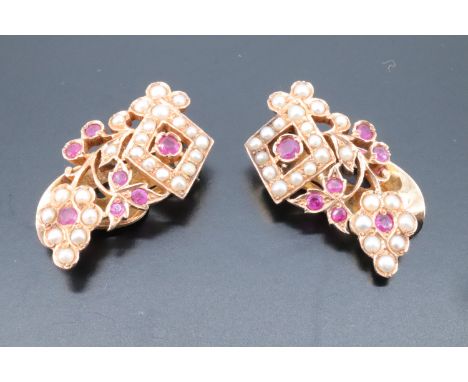 A pair of hand made ruby, spinel and pearl earrings, formed as grape vine openwork with small red stones and seed pears, drap