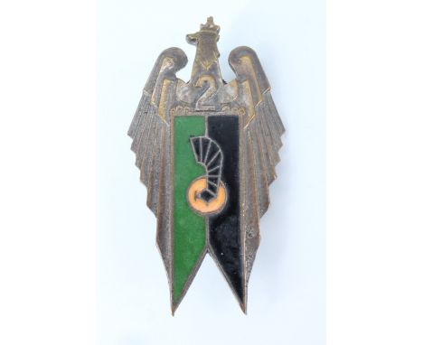 A Second World War Free Polish Army 2nd Motorized Artillery Regiment enamelled breast badge