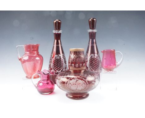 A pair of ruby flashed and cut glass decanters, together with a similar lamp base, etc (the lamp base a conversion)