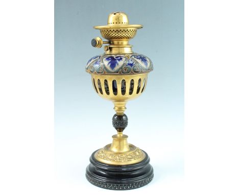 A Victorian oil lamp having a stoneware reservoir by Doulton at Lambeth, bearing indistinct impressed marks, having a Hinks' 