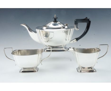 An Art Deco electroplate three piece tea service, teapot 15 cm high