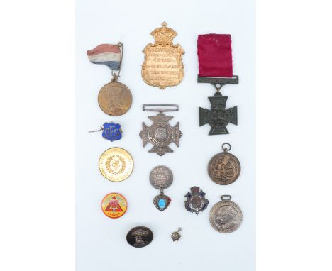 A group of Victorian and later medallions etc, including a brooched livery button, a Daily Mail Teddy Tail League medallion, 