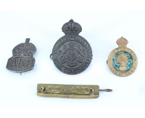 A Women's Land Army cap badge, together with a silver ARP badge, a Wounded Stripe and a Special Constabulary badge