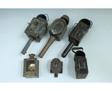 Four Victorian carriage lamps together with a Victorian brass hand lamp, tallest 40 cm