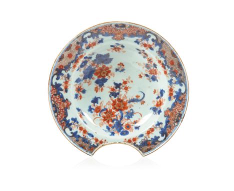 An "Imari" barbers bowlChinese export porcelainBlue underglaze, iron oxide and gilt floral decorationQing dynasty, 18th centu