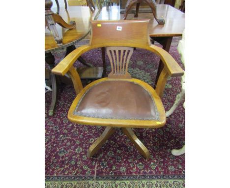 VINTAGE TUB SWIVEL OFFICE CHAIR, pierced oak slat back with original castors 