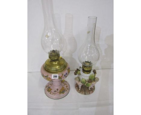 OIL LAMPS, Continental porcelain amorini support oil lamp base, with glass chimney, also Edwardian pink ground floral design 