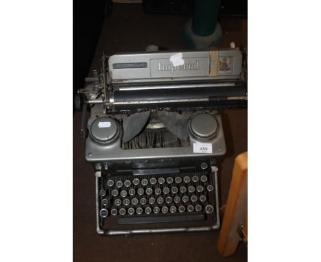 A VINTAGE IMPERIAL TYPEWRITER TOGETHER WITH A HARD SUITCASE