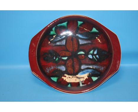 A POOLE POTTERY ART CHARGER
