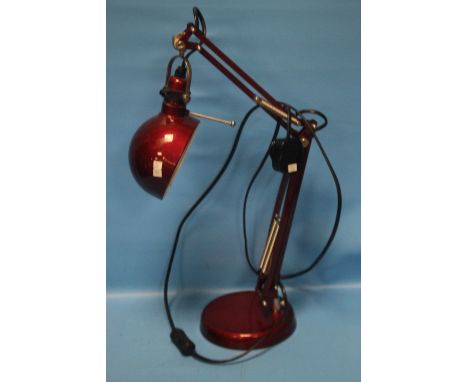 A RED ANGLEPOISE LAMP