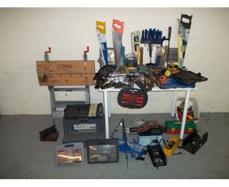A SELECTION OF TOOLS TO INCLUDE A WORKMAT, STORAGE STEPS, SAWS AND A SCREWDRIVER SET.