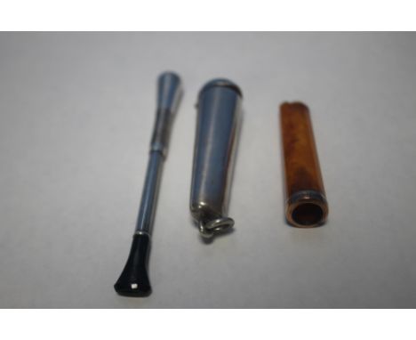 A GOLD AND AMBER CIGARETTE HOLDER, A SILVER CIGARETTE HOLDER AND A SILVER CASE