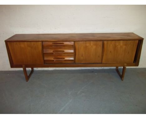 A VINTAGE RETRO TEAK SIDEBOARD.