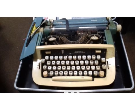 A CASED VINTAGE IMPERIAL TYPEWRITER