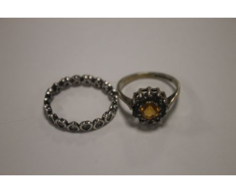 A PANDORA BAND OF HEARTS SILVER DRESS RING TOGETHER WITH A LADIES SILVER DRESS RING WITH CENTRAL AMBER COLOURED STONE  (2)