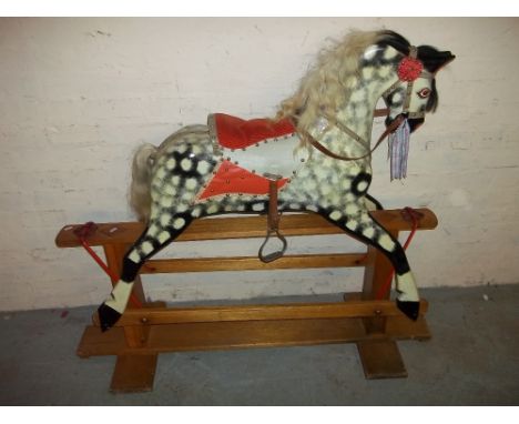 A VINTAGE ROCKING HORSE.