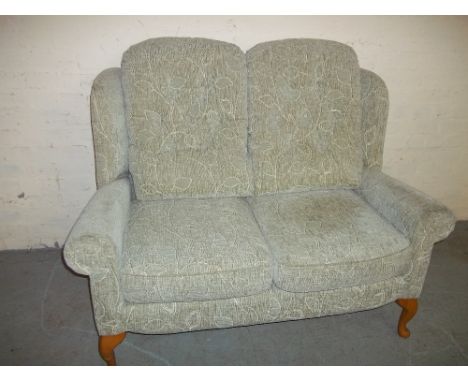 A CLEAN FABRIC MODERN TWO SEATER HIGH BACKED SOFA