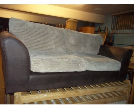 A MODERN THREE SEAT JUMBO CHORD SOFA