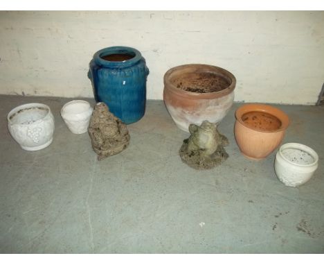 A MIXED SELECTION OF GARDEN PLANTER POTS GLAZED AND TERRACOTTA  AND TWO CONCRETE STATUES.